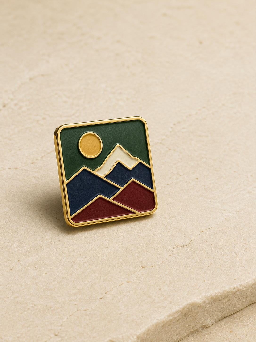 Complete custom soft enamel mountain pin with raised gold outlines and recessed color